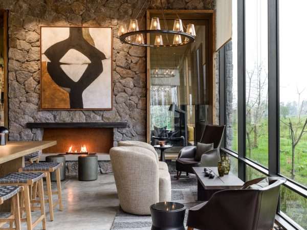 Singita-Kwitonda-Lodge-Lounge-Area-with-Fireplace