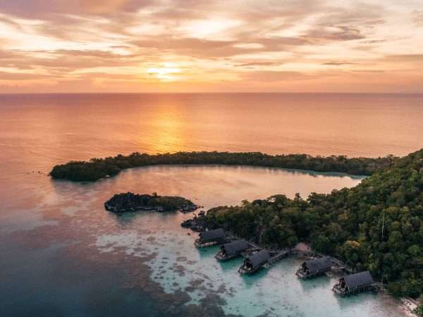 aerial_overwater_suite_sunset_with_setigi_reef_background