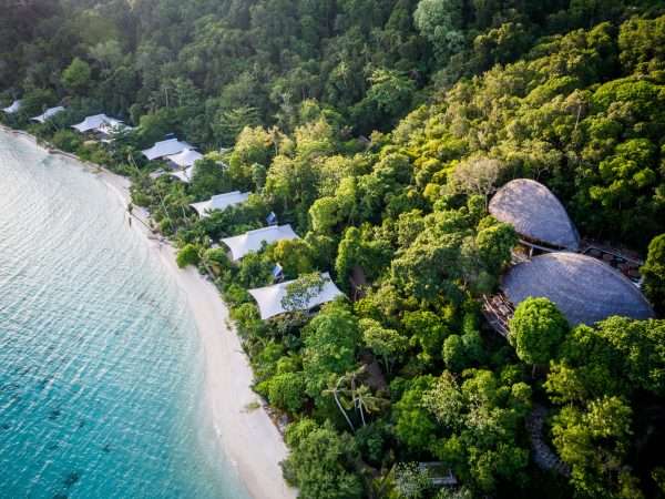 aerial_west_beach_suites_green_forest_background