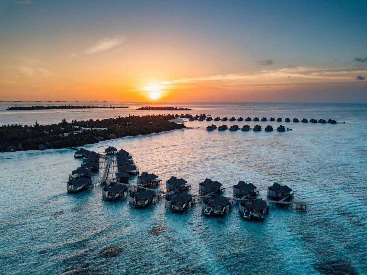Six_Senses_Laamu_Sunset_Aerial_[9586-LARGE]