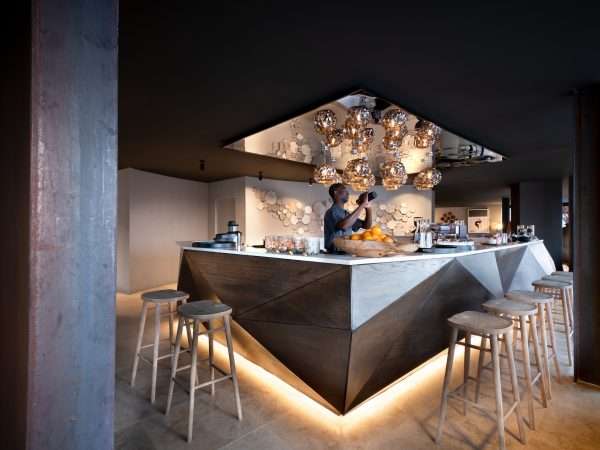 Sossusvlei-Desert-Lodge-general-guest-area-bar-with-barman-Collections-5000w
