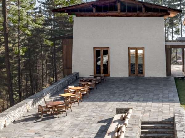 Amankora, Bhutan - Accommodation, Thimphu Lodge, Outdoor Terrace with view of Living Room beyond and Library below