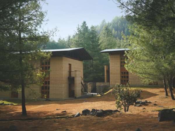 Amankora, Bhutan . Accommodation, Paro lodge, Suites exterior next to brooks and pine forest