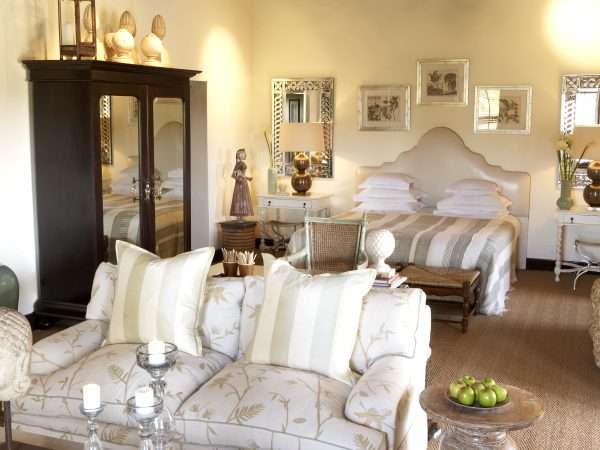 7. Bushmans Kloof Deluxe Room bed and seating area