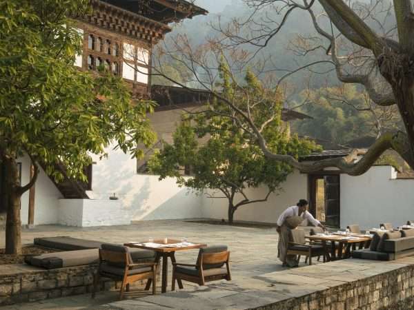 Amankora, Bhutan - Dining, Punakha Lodge, Farmhouse Courtryard dining set-up