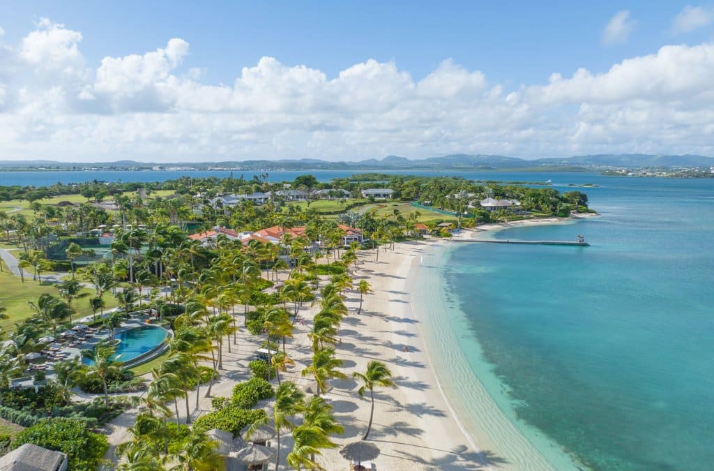 Enjoy Jumby Bay Island, an exclusive Antigua retreat with white-sand beaches, villas, and world-class dining.